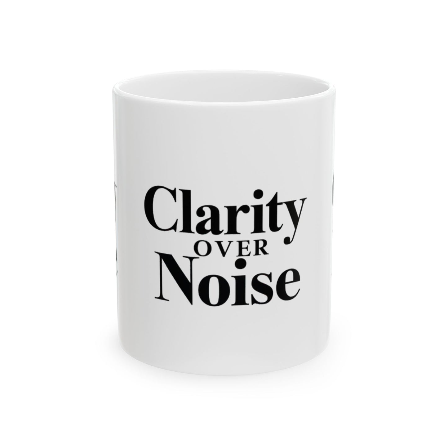 White mug with 'Clarity Over Noise' text on a white background Motivational trading mug next to stock market book on desk with laptop and charts